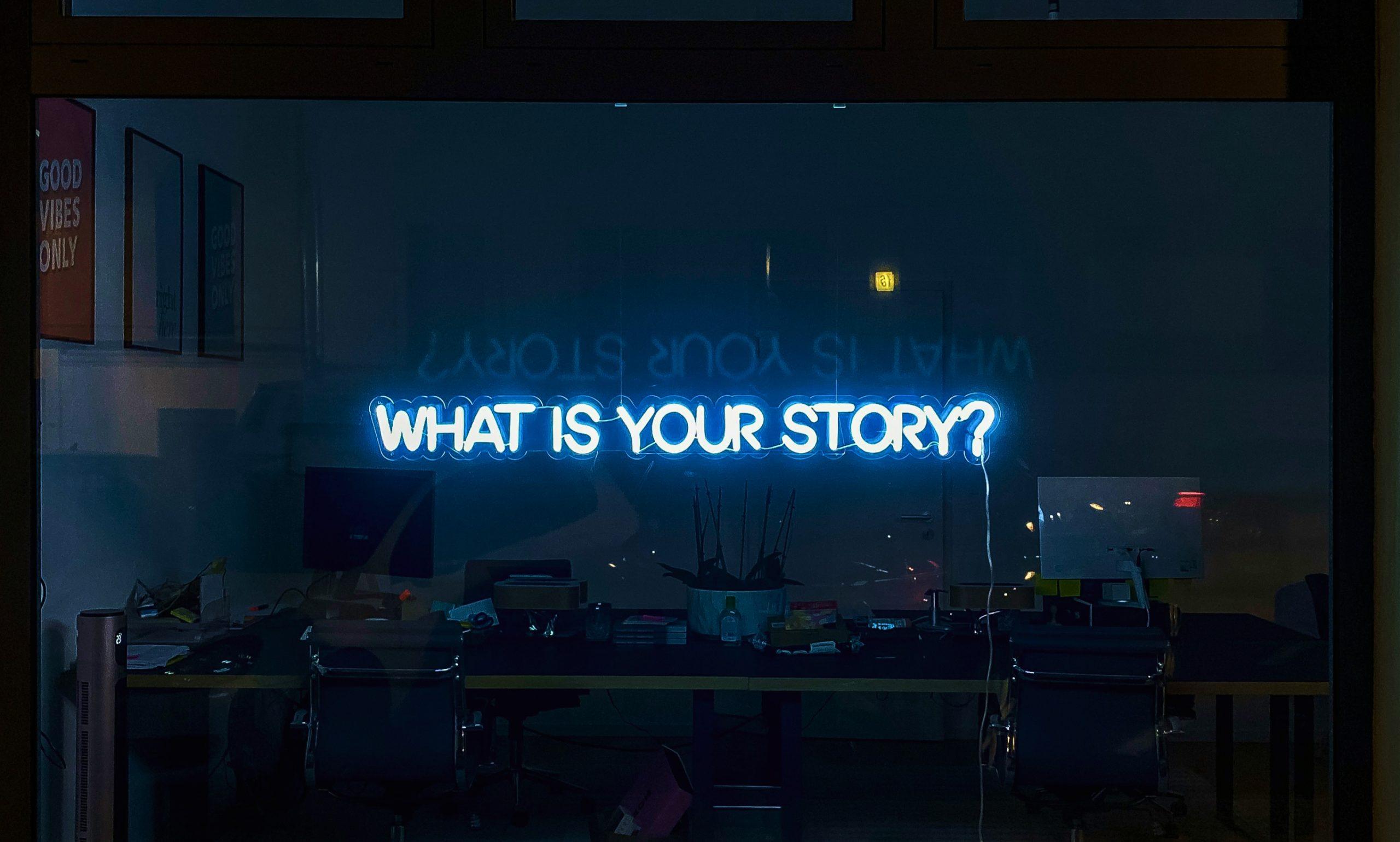 Brand Purpose - Image shows a neon sign reading 'what is your story?'